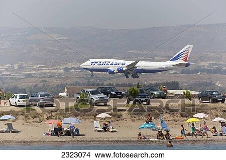 Plane landing near beach; Cyprus View Large Photo Image Picture - Plane landing near beach; Cyprus. Fotosearch