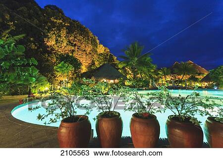 Stock Image - Plants In Pots Along The Poolside Of Bora Bora Nui Resort & Spa Bora Bora Island Society Islands French Polynesia South Pacific. Fotosearch