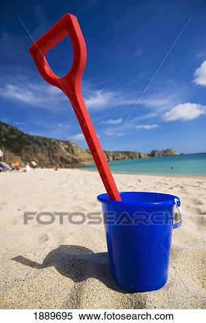 Plastic Bucket And Spade On Porthcurno Beach, Low Angle View View Large Photo Image Stock Photography - Plastic Bucket And Spade On Porthcurno Beach, Low Angle View. Fotosearch
