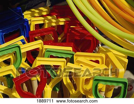 Stock Image - Plastic Spade Handles And Hula-Hoops. Fotosearch