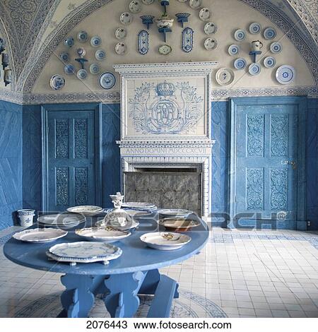 Stock Image - Plates On Display In A Blue And White Room In Drottningholm Palace; Stockholm Sweden. Fotosearch