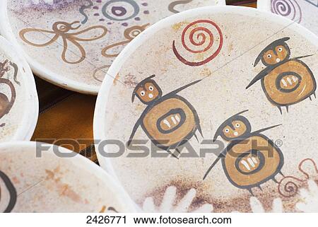 Stock Image - Plates with native designs at a craft market in the Andes; Mendoza, Argentina. Fotosearch