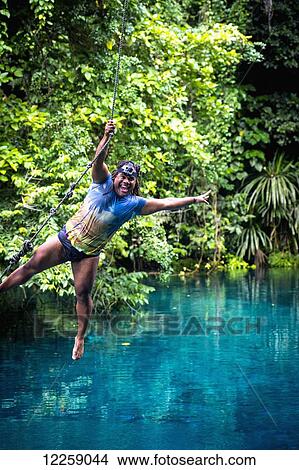 Picture - Playing at the Blue Holes; Santo Island, Vanuatu. Fotosearch