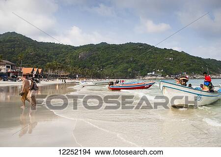Playing on the beaches of Haad Rin; Ko Phangan, Thailand View Large Photo Image Picture - Playing on the beaches of Haad Rin; Ko Phangan, Thailand. Fotosearch
