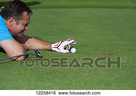 Stock Photograph - Playing on the golfing green; Bandar Seri Begawan, Brunei. Fotosearch