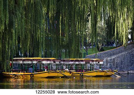 Stock Photo - Pleasure boats on the lake in Behai Park; Beijing, China. Fotosearch