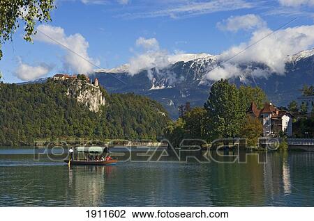 Pletna Boat On Lake Bled, Gorenjska Region, Slovenia View Large Photo Image Stock Image - Pletna Boat On Lake Bled, Gorenjska Region, Slovenia. Fotosearch