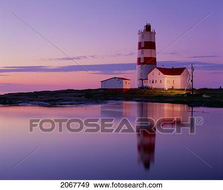 Stock Photo - Pointe Des Monts Lighthouse At Dawn, Manicouagan Region, Quebec. Fotosearch