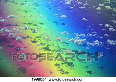Picture - Polarized Rainbow And Aerial Of Clouds Over The Ocean. Fotosearch