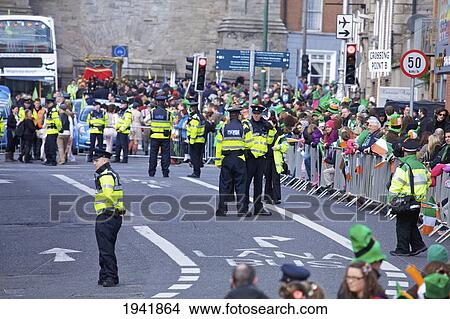 Picture - Police And A Crowd In The Street For The Saint Patrick's Day Parade; Dublin Ireland. Fotosearch