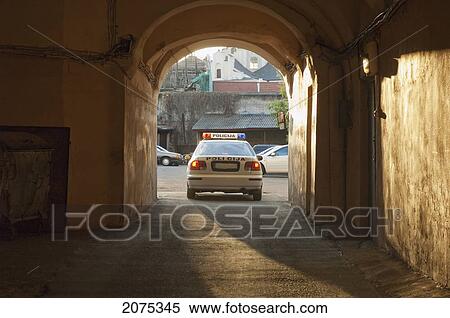 Stock Photography - Police Car In A Passage, Vilnius, Lithuania. Fotosearch