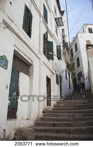 Stock Image - Police escort walking through the Casbah; Casbah, Algeria. Fotosearch
