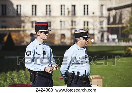 Stock Photo - Policemen on duty; Paris, France. Fotosearch