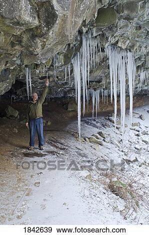 Ponytail Falls, Columbia River Gorge, Oregon, Usa; Hiker Examining Cave Icicles View Large Photo Image Stock Photo - Ponytail Falls, Columbia River Gorge, Oregon, Usa; Hiker Examining Cave Icicles. Fotosearch
