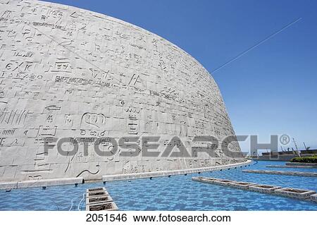 Stock Photograph - Pool And Hand-Carved Granite Wall With Stones Of The Bibliotheca Alexandrina, The Modern Library Of Alexandria, Alexandria, Al Iskandar. Fotosearch
