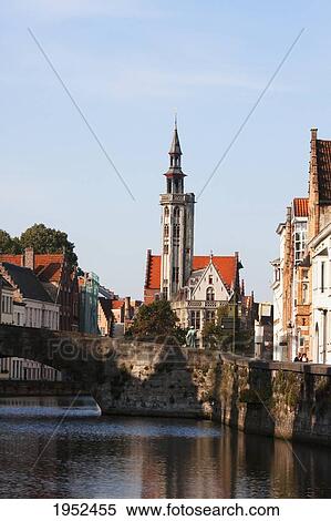 Poortersloge spire and buildings in the Hanseatic Quarter, as seen from a canal, Bruges (Brugge), West Flanders, Belgium View Large Photo Image Stock Photography - Poortersloge spire and buildings in the Hanseatic Quarter, as seen from a canal, Bruges (Brugge), West Flanders, Belgium. Fotosearch
