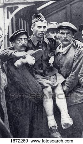 Porters At Boulogne, France, Carrying A Scot Soldier Who Has Been Wounded In Both Feet During The First World War. From The Illustrated War News Published 1914 View Large Photo Image Stock Photo - Porters At Boulogne, France, Carrying A Scot Soldier Who Has Been Wounded In Both Feet During The First World War. From The Illustrated War News Published 1914. Fotosearch