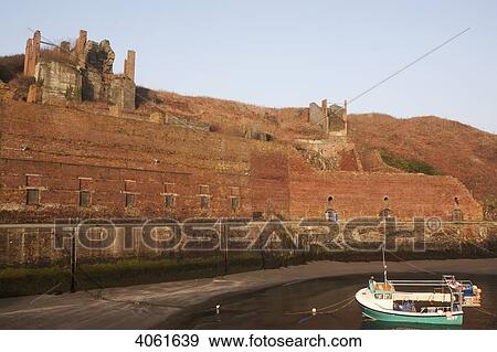 Stock Photo - Porthgain harbour, which has a wealth of historical relics from its time as an industrial harbour; Pembrokeshire, Wales. Fotosearch