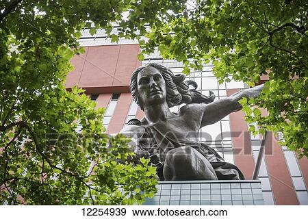 Portlandia sculpture by Raymond Kaskey above the entrance of the Portland Building in downtown; Portland, Oregon, United States of America View Large Photo Image Stock Photo - Portlandia sculpture by Raymond Kaskey above the entrance of the Portland Building in downtown; Portland, Oregon, United States of America. Fotosearch