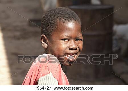 Stock Photo - Portrait of a boy in Djenne, Mali. Fotosearch