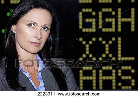 Portrait Of A Business Woman In Front Of Stock Market Index; Toronto, Ontario, Canada View Large Photo Image Stock Image - Portrait Of A Business Woman In Front Of Stock Market Index; Toronto, Ontario, Canada. Fotosearch