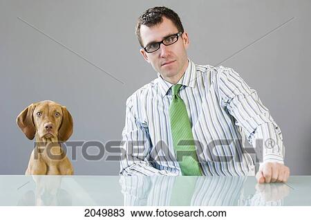 Portrait Of A Businessman At A Desk With His Dog View Large Photo Image Stock Image - Portrait Of A Businessman At A Desk With His Dog. Fotosearch