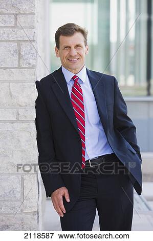 Stock Photo - Portrait Of A Businessman Outdoors; Bradford Ontario Canada. Fotosearch