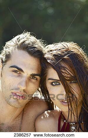 Stock Photo - Portrait of a couple on the beach; Hawaii, United States of America. Fotosearch