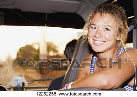 Stock Photo - Portrait of a female tourist on a tour bus; Laos. Fotosearch