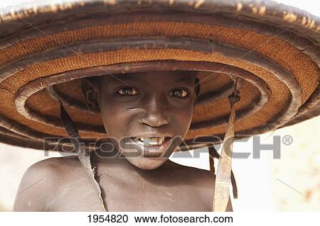 Stock Image - Portrait of a Fulani boy in Youga, Mali. Fotosearch