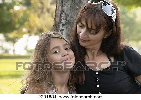 Picture - Portrait Of A Grandmother And Her Granddaughter Outdoors; Whitby Ontario Canada. Fotosearch