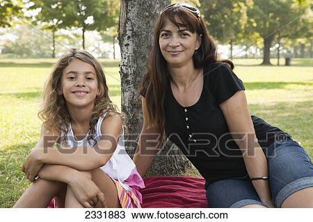Portrait Of A Grandmother And Her Granddaughter Outdoors; Whitby Ontario Canada View Large Photo Image Stock Image - Portrait Of A Grandmother And Her Granddaughter Outdoors; Whitby Ontario Canada. Fotosearch