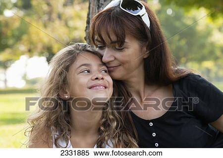 Stock Photography - Portrait Of A Grandmother And Her Granddaughter Outdoors; Whitby Ontario Canada. Fotosearch