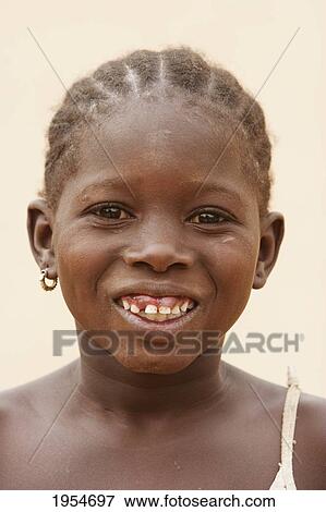 Stock Photo - Portrait of a happy girl in Segou, Mali. Fotosearch