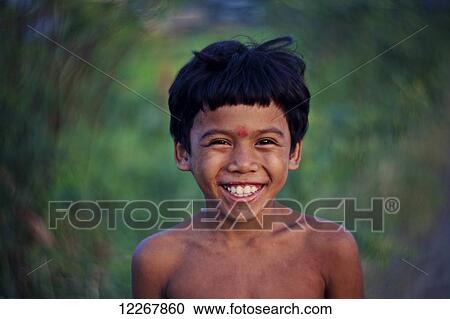 Stock Image - Portrait of a Khmer boy; Kompong Cham, Cambodia. Fotosearch