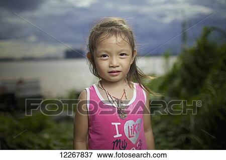 Stock Photo - Portrait of a Khmer girl; Phnom Penh, Cambodia. Fotosearch