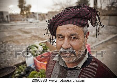 Stock Image - Portrait Of A Kurdish Street Vendor, Sulaymaniyah, Iraqi Kurdistan, Iraq. Fotosearch