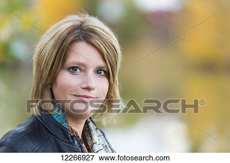 Portrait of a mature woman in a park in autumn; Edmonton, Alberta, Canada View Large Photo Image Stock Photo - Portrait of a mature woman in a park in autumn; Edmonton, Alberta, Canada. Fotosearch