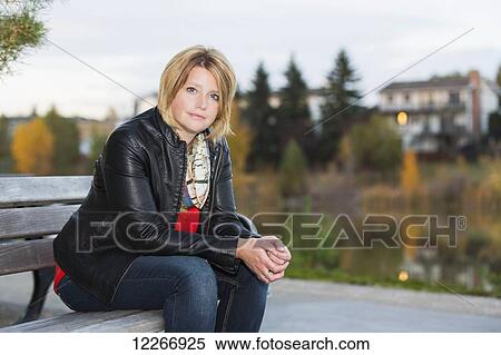 Portrait of a mature woman in a park in autumn; Edmonton, Alberta, Canada View Large Photo Image Stock Photography - Portrait of a mature woman in a park in autumn; Edmonton, Alberta, Canada. Fotosearch
