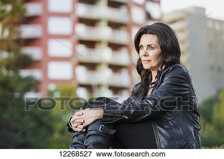 Portrait of a mature woman outdoors in an urban setting; Edmonton, Alberta, Canada View Large Photo Image Stock Photo - Portrait of a mature woman outdoors in an urban setting; Edmonton, Alberta, Canada. Fotosearch