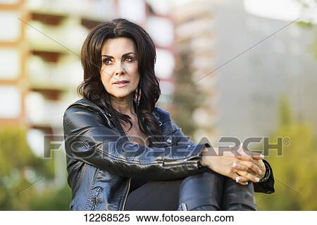 Stock Photography - Portrait of a mature woman outdoors in an urban setting; Edmonton, Alberta, Canada. Fotosearch