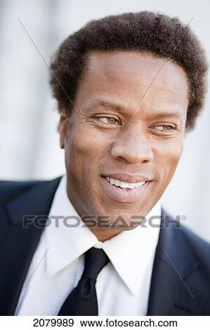 Stock Photo - Portrait Of A Mixed Race Businessman; Vancouver, British Columbia, Canada. Fotosearch
