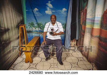 Stock Image - Portrait of a photographer in his studio; Harar, Ethiopia. Fotosearch