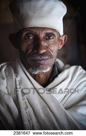 Portrait of a priest in Debre Berhan Selassie church; Gondar, Amhara region, Ethiopia View Large Photo Image Stock Photo - Portrait of a priest in Debre Berhan Selassie church; Gondar, Amhara region, Ethiopia. Fotosearch