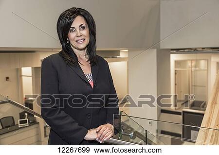 Stock Photo - Portrait of a professional businesswoman in office setting; Edmonton, Alberta, Canada. Fotosearch