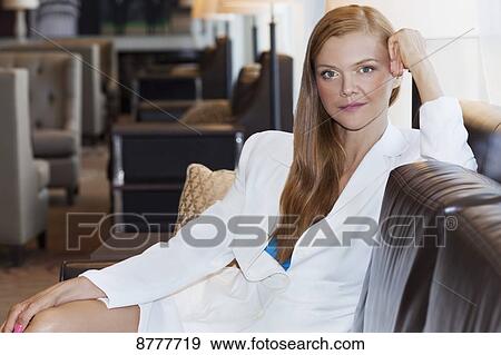 Stock Photo - Portrait of a redheaded businesswomen; Toronto, Ontario, Canada. Fotosearch