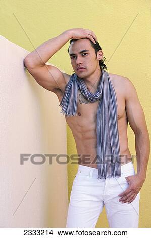 Picture - Portrait of a shirtless man wearing a scarf; Honolulu, Oahu, Hawaii, United States of America. Fotosearch