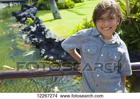 Portrait of a young boy at the Poipu Grand Hyatt Hotel, Southern Kauai; Kauai, Hawaii, United States of America View Large Photo Image Picture - Portrait of a young boy at the Poipu Grand Hyatt Hotel, Southern Kauai; Kauai, Hawaii, United States of America. Fotosearch