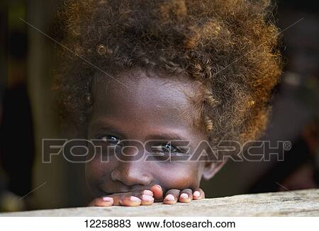 Stock Image - Portrait of a young Solomon Island girl; Gizo, Western Province, Solomon Islands. Fotosearch