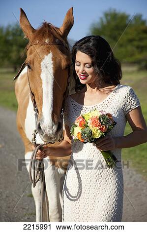 Portrait of a young woman an her horse. View Large Photo Image Stock Image - Portrait of a young woman an her horse.. Fotosearch